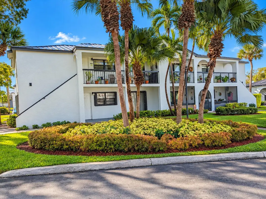 Tropical Palm-Framed Condominium Exterio